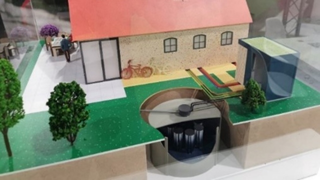 model of a rainwater collection system with underground tank
